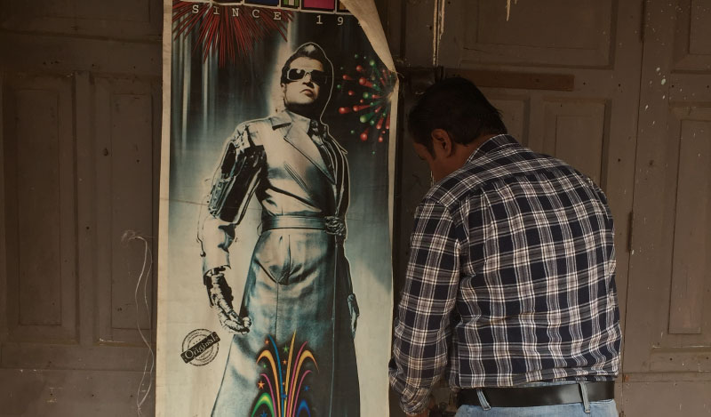 Chetan Parikh opens the shutters of his fireworks store in Jhumri Telaiya